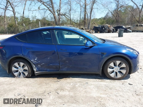 2021 Tesla Model Y Long Range with VIN 5YJYGAEE1MF207948, listed as a IAAI auction lot 41779570 with 100,859 mi miles. Bid and sale history available at carsss.com. Image 13.