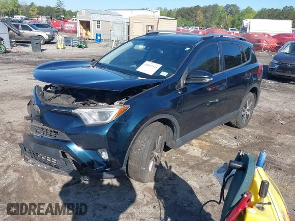 2018 Toyota RAV4 XLE with VIN JTMWFREV5JJ739619, listed as a IAAI auction lot 42017343 with 126,810 mi miles and . Bid and sale history available at DreamBid. Image 18.