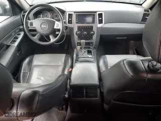 2010 Jeep Grand Cherokee Laredo with VIN 1J4RR4GT7AC120604, listed as a Copart auction lot 84257724 with 60,827 mi miles and Salvage Title. Bid and sale history available at carsss.com. Image 8.