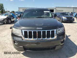 2011 Jeep Grand Cherokee Laredo z VIN 1J4RR4GG9BC614502, wystawiony jako Copart lot #64179275 z przebiegiem 189 284 mil mil oraz Czysty tytuł • Clean title. Historia ofert i sprzedaży dostępna na DreamBid. Obrazek 5.