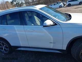 2017 BMW X1 xDrive28i with VIN WBXHT3C37H5F69725, listed as a IAAI auction lot 41588095 with 109,704 mi miles. Bid and sale history available at carsss.com. Image 13.