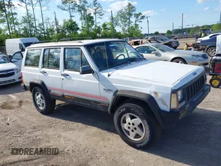 1994 Jeep Cherokee Sport z VIN 1J4FT68S7RL160652, wystawiony jako IAAI lot #41992392 z przebiegiem 158 122 mil mil oraz . Historia ofert i sprzedaży dostępna na DreamBid. Obrazek 1.