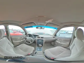 1999 Toyota Camry LE z VIN JT2BG22K0X0295893, wystawiony jako Copart lot #56183655 z przebiegiem 327 172 mil mil oraz Szkoda całkowita • Salvage title. Historia ofert i sprzedaży dostępna na DreamBid. Obrazek 14.