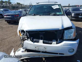 2006 GMC Envoy SLE with VIN 1GKDT13S662355509, listed as a IAAI auction lot 41628732 with 187,635 mi miles. Bid and sale history available at carsss.com. Image 6.