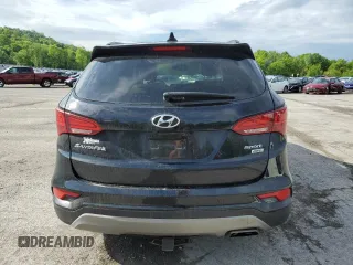 2017 Hyundai Santa Fe 2.4L z VIN 5XYZUDLB1HG412675, wystawiony jako Copart lot #57169045 z przebiegiem 38 947 mil mil oraz Szkoda całkowita • Salvage title. Historia ofert i sprzedaży dostępna na DreamBid. Obrazek 6.