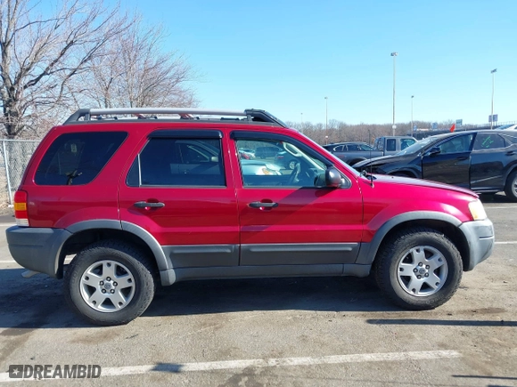 2003 Ford Escape XLT Popular 2 with VIN 1FMCU93183KC65571, listed as a IAAI auction lot 41768982 with 150,658 mi miles. Bid and sale history available at carsss.com. Image 13.