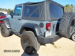 2015 Jeep Wrangler Sport with VIN 1C4AJWAG0FL591213, listed as a IAAI auction lot 41893306 with 107,807 mi miles and . Bid and sale history available at DreamBid. Image 3.