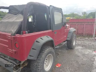 2000 Jeep Wrangler Sport with VIN 1J4FA49S2YP764321, listed as a IAAI auction lot 42385965 with Not provided miles and . Bid and sale history available at DreamBid. Image 4.