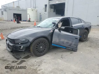 2019 Dodge Charger Police with VIN 2C3CDXKT2KH647276, listed as a Copart auction lot 58411615 with 70,439 mi miles and Salvage title. Bid and sale history available at DreamBid. Image 1.