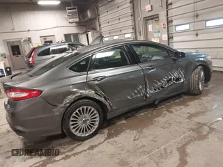 2013 Ford Fusion Titanium Hybrid with VIN 3FA6P0RU6DR319586, listed as a IAAI auction lot 42138979 with 125,388 mi miles. Bid and sale history available at carsss.com. Image 4.
