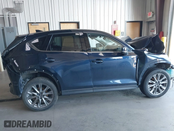 2020 Mazda CX-5 Grand Touring with VIN JM3KFBDM8L0781491, listed as a IAAI auction lot 39788385 with 57,316 mi miles and . Bid and sale history available at carsss.com. Image 13.