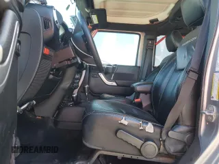 2014 Jeep Wrangler Unlimited Rubicon X with VIN 1C4BJWFG2EL308077, listed as a Copart auction lot 54439265 with 160,746 mi miles and Salvage title. Bid and sale history available at DreamBid. Image 7.