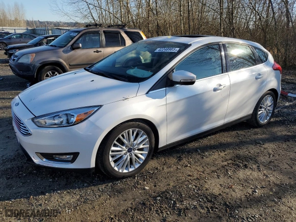 2015 Ford Focus Titanium with VIN 1FADP3N25FL325037, listed as a Copart auction lot 42248985 with 58,831 mi miles and Salvage Title. Bid and sale history available at carsss.com. Image 1.