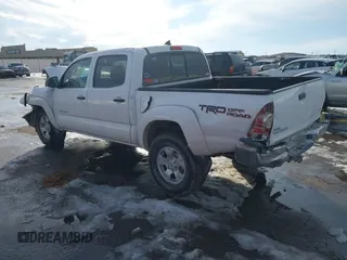 2014 Toyota Tacoma with VIN 3TMLU4ENXEM134872, listed as a IAAI auction lot 41303669 with 167,548 mi miles. Bid and sale history available at carsss.com. Image 3.