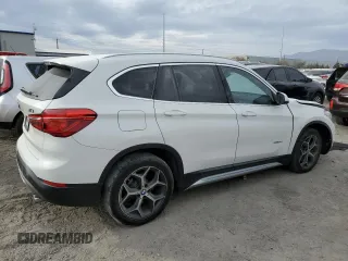 2018 BMW X1 sDrive28i with VIN WBXHU7C37J5H44386, listed as a Copart auction lot 42167135 with 96,668 mi miles and Salvage Title. Bid and sale history available at DreamBid. Image 3.