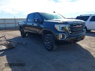 2021 GMC Sierra 1500 AT4 with VIN 1GTU9EETXMZ230606, listed as a IAAI auction lot 41599778 with 128,745 mi miles. Bid and sale history available at carsss.com. Image 1.