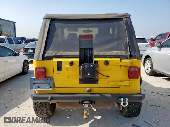 2003 Jeep Wrangler Sport with VIN 1J4FA49S43P369906, listed as a Copart auction lot 58079235 with 139,547 mi miles and Salvage title. Bid and sale history available at DreamBid. Image 6.