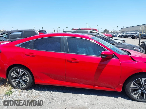 2016 Honda Civic EX-L z VIN 2HGFC1F79GH633213, wystawiony jako IAAI lot #42226171 z przebiegiem 107 023 mil mil oraz . Historia ofert i sprzedaży dostępna na DreamBid. Obrazek 13.