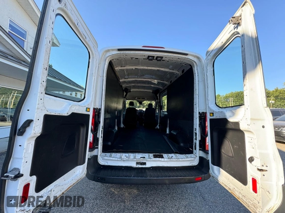 2015 Ford Transit Cargo with VIN 1FTNE2CM4FKA17642, listed as a Copart auction lot 71286284 with 664,494 mi miles and Clean Title. Bid and sale history available at carsss.com. Image 12.