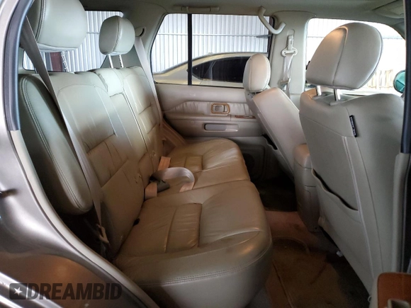 2001 Infiniti QX4 with VIN JNRDR09X21W204448, listed as a Copart auction lot 82619574 with 114,520 mi miles and Salvage Title. Bid and sale history available at DreamBid. Image 11.