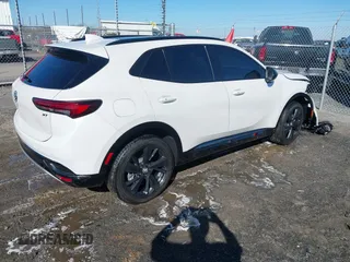2023 Buick Envision Essence with VIN LRBFZPR40PD195596, listed as a IAAI auction lot 41613206 with 15,597 mi miles. Bid and sale history available at carsss.com. Image 4.