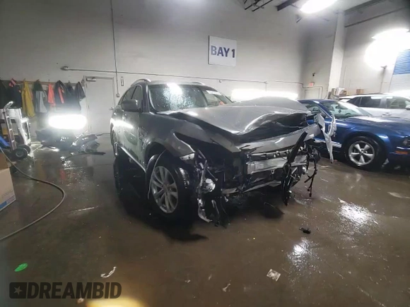 2014 Infiniti QX70 z VIN JN8CS1MW5EM412429, wystawiony jako Copart lot #82933934 z przebiegiem Nie podano mil oraz Szkoda całkowita • Salvage title. Historia ofert i sprzedaży dostępna na DreamBid. Obrazek 14.
