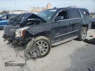 2015 GMC Yukon Denali with VIN 1GKS1CKJ2FR699959, listed as a Copart auction lot 42035195 with 0 mi miles and Salvage Title. Bid and sale history available at carsss.com. Image 1.
