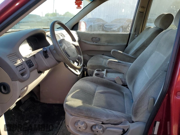 2005 Kia Sedona LX with VIN KNDUP132156669009, listed as a Copart auction lot 76936094 with 124,989 mi miles and Salvage Title. Bid and sale history available at carsss.com. Image 7.
