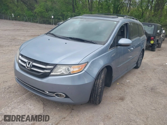 2014 Honda Odyssey Touring with VIN 5FNRL5H91EB081811, listed as a IAAI auction lot 42153920 with 16 mi miles and . Bid and sale history available at DreamBid. Image 2.