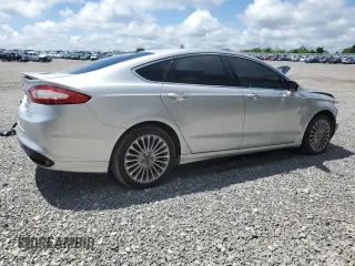 2016 Ford Fusion Titanium z VIN 3FA6P0D94GR181179, wystawiony jako Copart lot #56987005 z przebiegiem 79 841 mil mil oraz Czysty tytuł • Clean title. Historia ofert i sprzedaży dostępna na DreamBid. Obrazek 3.