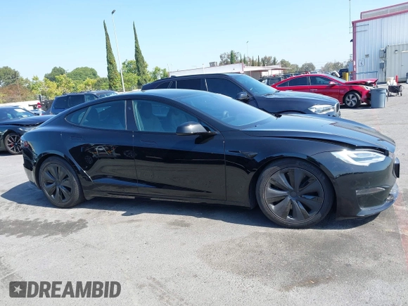2022 Tesla Model S with VIN 5YJSA1E5XNF467435, listed as a IAAI auction lot 42538706 with 26,504 mi miles and . Bid and sale history available at DreamBid. Image 13.