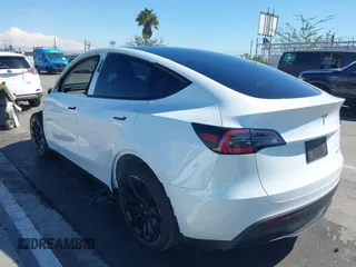 2023 Tesla Model Y Long Range with VIN 7SAYGDEEXPA129790, listed as a IAAI auction lot 41735721 with 20,402 mi miles and . Bid and sale history available at DreamBid. Image 3.