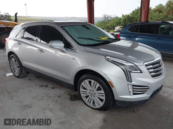 2018 Cadillac XT5 Premium Luxury FWD z VIN 1GYKNERS7JZ214504, wystawiony jako IAAI lot #40067507 z przebiegiem Nie podano mil oraz . Historia ofert i sprzedaży dostępna na DreamBid. Obrazek 1.