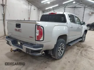 2015 GMC Canyon 4WD SLE z VIN 1GTG6BE39F1252926, wystawiony jako IAAI lot #42128396 z przebiegiem 113 139 mil mil oraz . Historia ofert i sprzedaży dostępna na DreamBid. Obrazek 4.