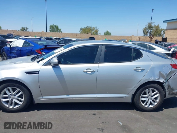 2013 Kia Optima LX z VIN KNAGM4A7XD5389662, wystawiony jako IAAI lot #42265945 z przebiegiem 164 488 mil mil oraz . Historia ofert i sprzedaży dostępna na DreamBid. Obrazek 15.