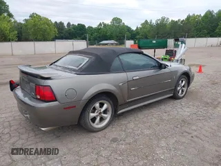 2001 Ford Mustang Deluxe z VIN 1FAFP44411F159656, wystawiony jako IAAI lot #42123128 z przebiegiem 191 814 mil mil oraz . Historia ofert i sprzedaży dostępna na DreamBid. Obrazek 4.