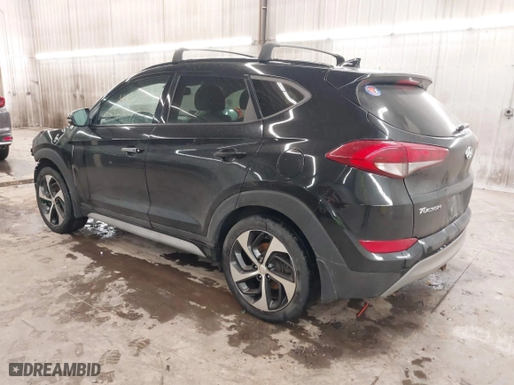2018 Hyundai Tucson Value with VIN KM8J3CA28JU648236, listed as a IAAI auction lot 41161221 with 104,057 mi miles. Bid and sale history available at carsss.com. Image 3.