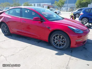 2021 Tesla Model 3 Standard Range Plus with VIN 5YJ3E1EA0MF099562, listed as a IAAI auction lot 41771323 with 26,087 mi miles. Bid and sale history available at carsss.com. Image 1.