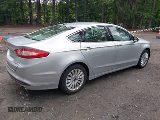 2013 Ford Fusion SE Hybrid z VIN 3FA6P0LU1DR291060, wystawiony jako IAAI lot #42731674 z przebiegiem 93 918 mil mil oraz . Historia ofert i sprzedaży dostępna na DreamBid. Obrazek 4.