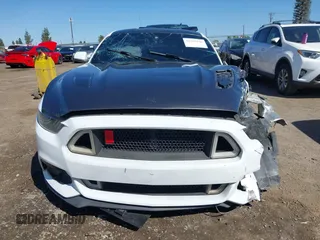 2016 Ford Mustang EcoBoost z VIN 1FA6P8TH3G5221133, wystawiony jako IAAI lot #42325336 z przebiegiem 135 065 mil mil oraz . Historia ofert i sprzedaży dostępna na DreamBid. Obrazek 13.