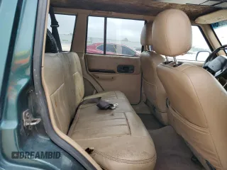 2001 Jeep Cherokee Sport with VIN 1J4FF58SX1L615967, listed as a Copart auction lot 43709235 with 241,326 mi miles and Clean title. Bid and sale history available at DreamBid. Image 11.