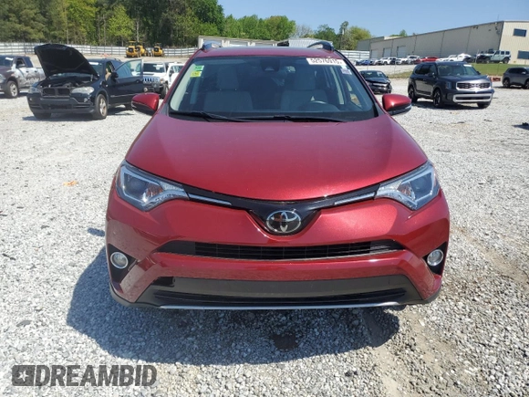2018 Toyota RAV4 XLE with VIN JTMWFREV7JD119143, listed as a Copart auction lot 52576915 with 56,947 mi miles and Salvage Title. Bid and sale history available at carsss.com. Image 5.