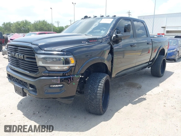 2021 Ram 2500 Laramie with VIN 3C6UR5FL7MG621346, listed as a IAAI auction lot 42419962 with 96,647 mi miles and . Bid and sale history available at DreamBid. Image 2.