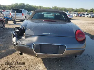 2003 Ford Thunderbird Deluxe z VIN 1FAHP60A63Y107026, wystawiony jako Copart lot #70650964 z przebiegiem 36 115 mil mil oraz Szkoda całkowita • Salvage title. Historia ofert i sprzedaży dostępna na DreamBid. Obrazek 6.