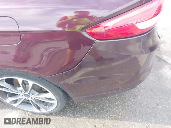 2017 Ford Fusion Titanium z VIN 3FA6P0K94HR271307, wystawiony jako IAAI lot #42595411 z przebiegiem 100 344 mil mil oraz . Historia ofert i sprzedaży dostępna na DreamBid. Obrazek 18.
