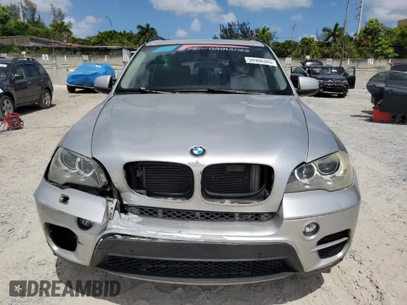 2013 BMW X5 xDrive35i z VIN 5UXZV4C5XD0B03182, wystawiony jako Copart lot #54906305 z przebiegiem 166 493 mil mil oraz Szkody całkowita. Historia ofert i sprzedaży dostępna na DreamBid. Obrazek 5.
