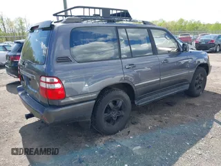 2003 Toyota Land Cruiser z VIN JTEHT05J932041288, wystawiony jako IAAI lot #42000615 z przebiegiem 166 159 mil mil oraz . Historia ofert i sprzedaży dostępna na DreamBid. Obrazek 4.