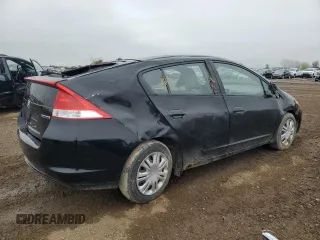 2010 Honda Insight LX with VIN JHMZE2H56AS022299, listed as a Copart auction lot 54872215 with 149,514 mi miles and Salvage title. Bid and sale history available at DreamBid. Image 3.