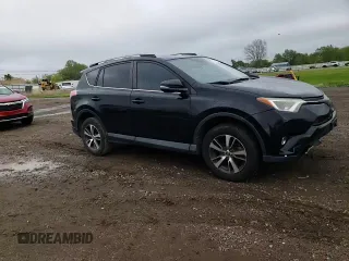 2018 Toyota RAV4 XLE with VIN 2T3WFREV0JW484430, listed as a Copart auction lot 55878455 with 132,335 mi miles and Salvage title. Bid and sale history available at DreamBid. Image 14.
