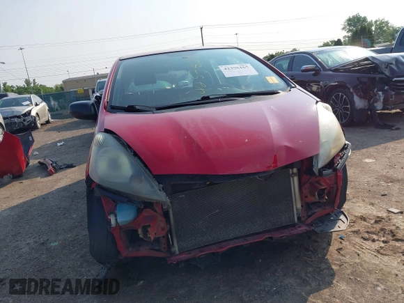 2009 Honda Fit z VIN JHMGE88219S023503, wystawiony jako IAAI lot #42376165 z przebiegiem 142 166 mil mil oraz . Historia ofert i sprzedaży dostępna na DreamBid. Obrazek 13.